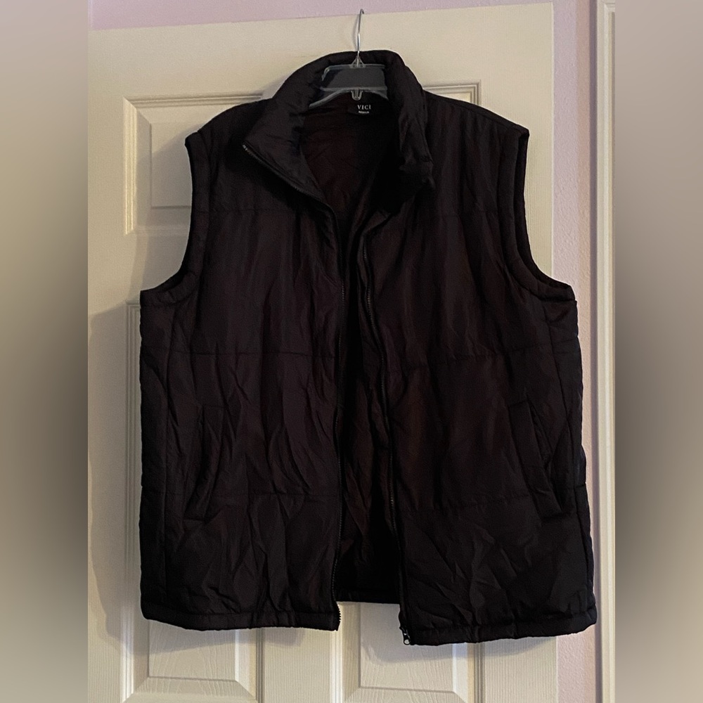 Lightweight, very loose fitting vest! Baggy fit. Brand new!!